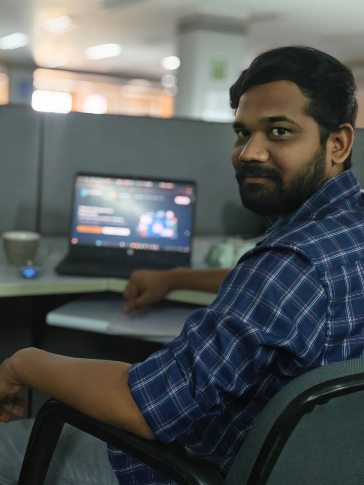 Govardhan, founder of HyderHub Web Services, working on a client website
